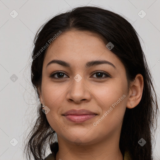 Joyful latino young-adult female with long  brown hair and brown eyes