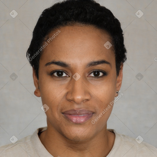 Joyful black young-adult female with short  black hair and brown eyes