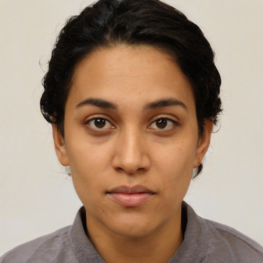 Neutral latino young-adult female with short  brown hair and brown eyes