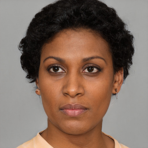 Neutral black young-adult female with short  brown hair and brown eyes