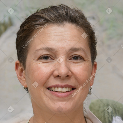 Joyful white adult female with short  brown hair and brown eyes