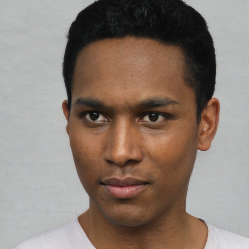 Neutral black young-adult male with short  black hair and brown eyes