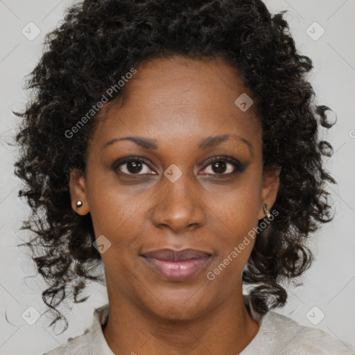 Joyful black adult female with medium  brown hair and brown eyes