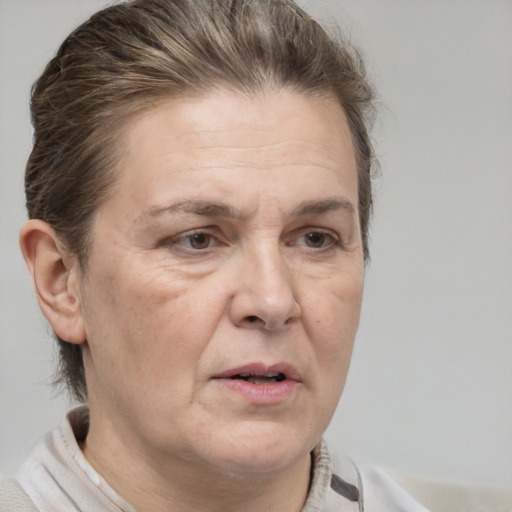 Joyful white adult female with short  brown hair and brown eyes