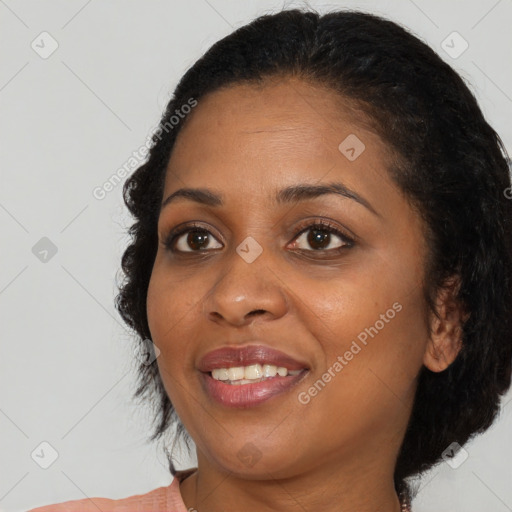 Joyful black young-adult female with medium  brown hair and brown eyes