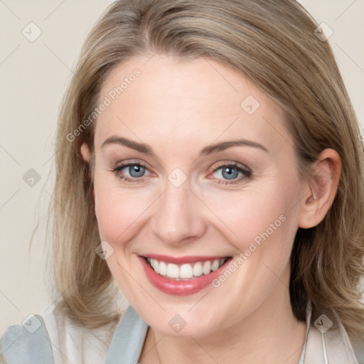 Joyful white young-adult female with medium  brown hair and blue eyes