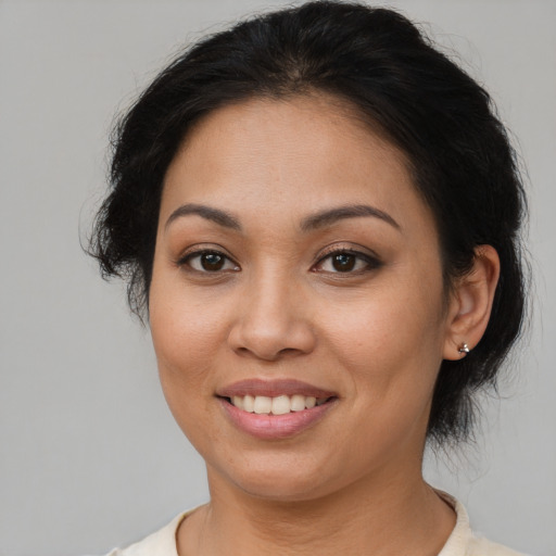 Joyful asian young-adult female with medium  brown hair and brown eyes