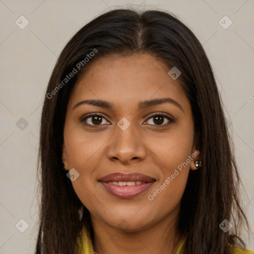 Joyful black young-adult female with long  brown hair and brown eyes