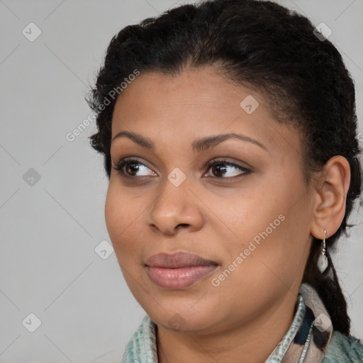 Joyful black young-adult female with medium  brown hair and brown eyes