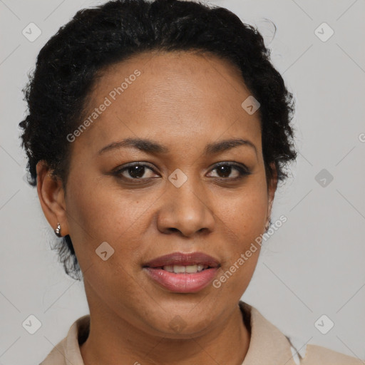 Joyful black adult female with short  brown hair and brown eyes