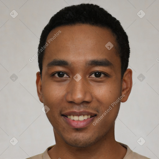 Joyful black young-adult male with short  black hair and brown eyes