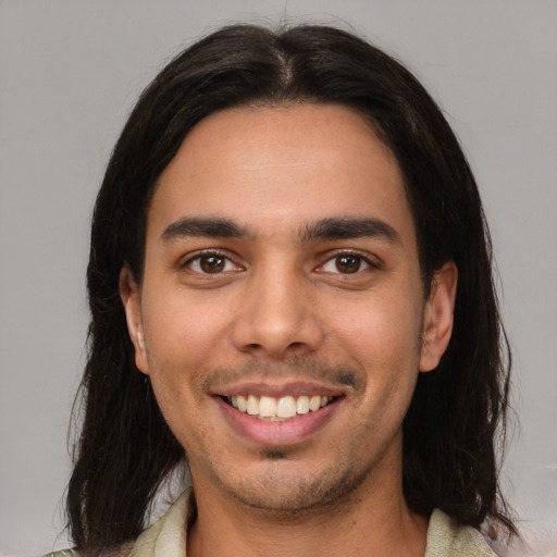 Joyful white young-adult male with medium  brown hair and brown eyes