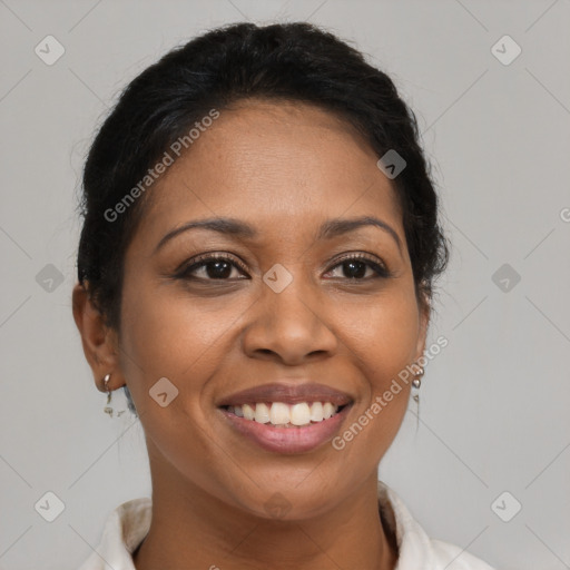 Joyful latino adult female with short  brown hair and brown eyes