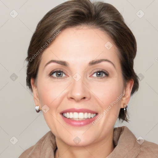 Joyful white adult female with medium  brown hair and grey eyes