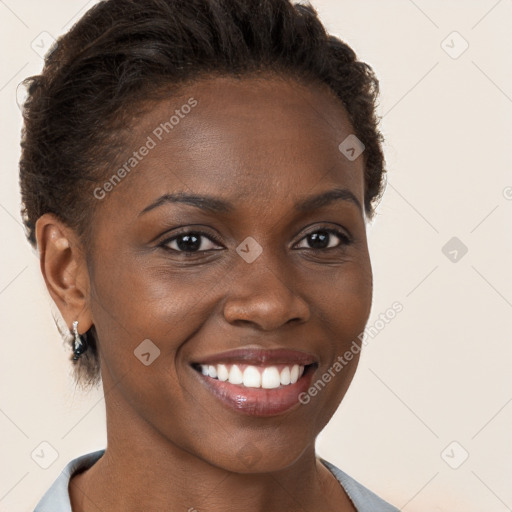 Joyful black young-adult female with short  brown hair and brown eyes