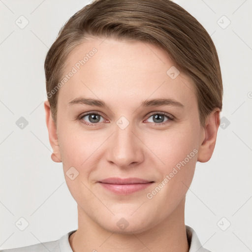 Joyful white young-adult female with short  brown hair and grey eyes