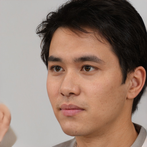Neutral white young-adult male with short  black hair and brown eyes