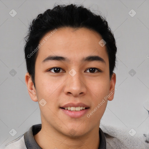 Joyful latino young-adult male with short  brown hair and brown eyes