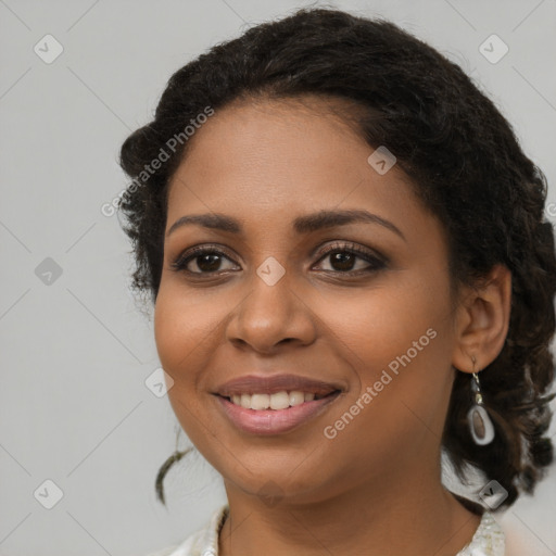 Joyful black young-adult female with medium  brown hair and brown eyes