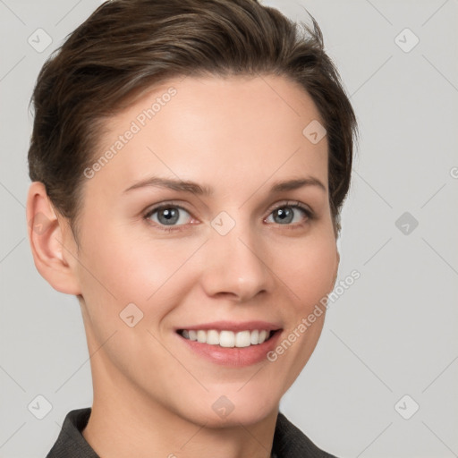 Joyful white young-adult female with short  brown hair and grey eyes