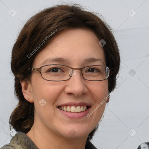 Joyful white adult female with medium  brown hair and grey eyes