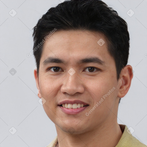 Joyful white young-adult male with short  black hair and brown eyes