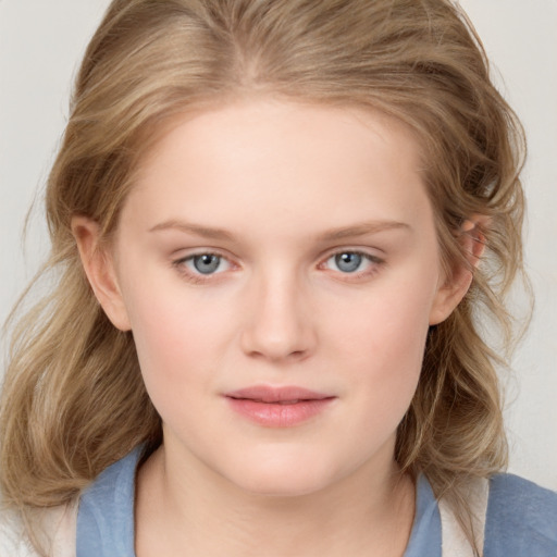 Joyful white child female with medium  brown hair and blue eyes