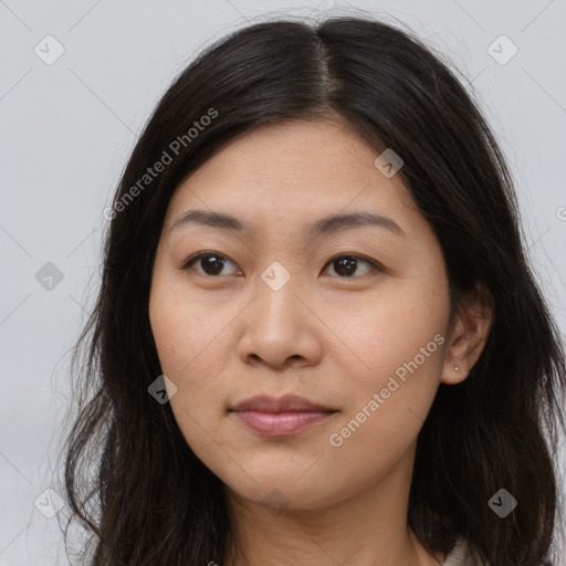 Joyful asian young-adult female with long  brown hair and brown eyes