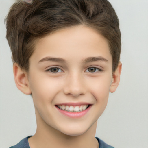 Joyful white child male with short  brown hair and brown eyes