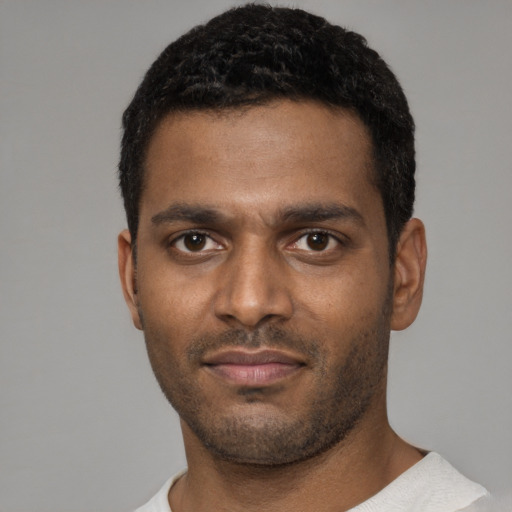 Neutral black young-adult male with short  black hair and brown eyes