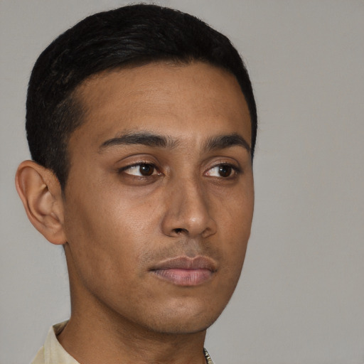 Neutral black young-adult male with short  brown hair and brown eyes