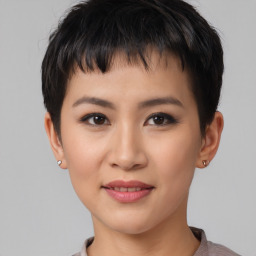 Joyful asian young-adult female with short  brown hair and brown eyes