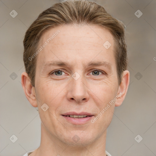 Joyful white adult male with short  brown hair and grey eyes