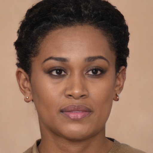 Joyful black young-adult female with short  brown hair and brown eyes