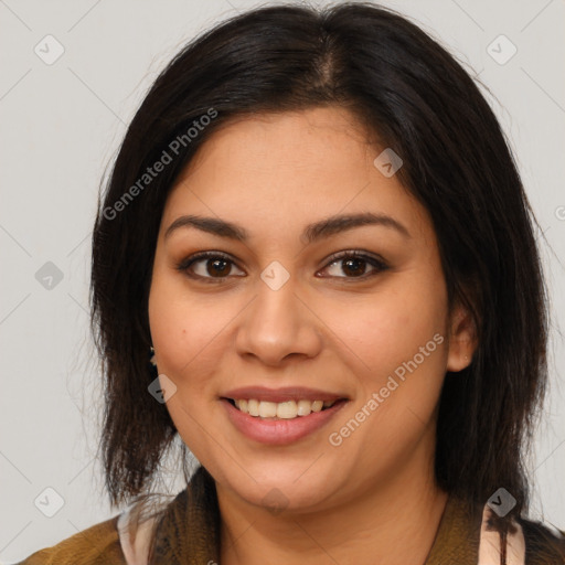 Joyful latino young-adult female with long  brown hair and brown eyes