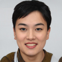 Joyful asian young-adult female with short  black hair and brown eyes