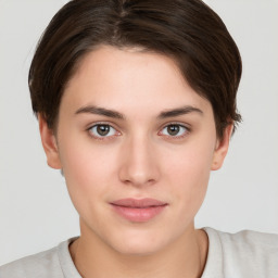 Neutral white young-adult female with short  brown hair and brown eyes