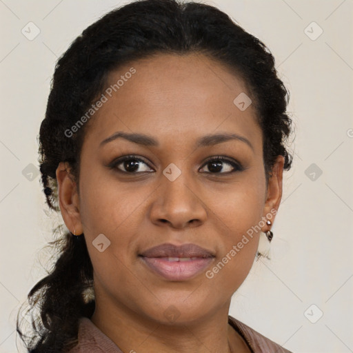 Joyful black young-adult female with long  brown hair and brown eyes
