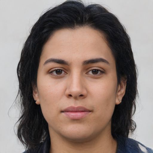 Neutral latino young-adult female with medium  brown hair and brown eyes