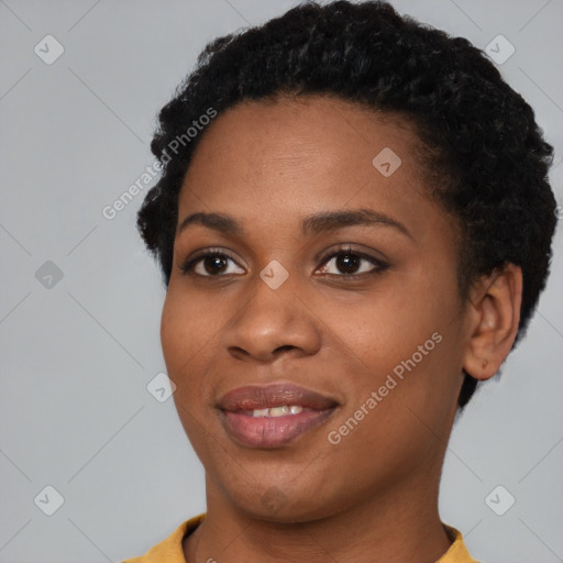 Joyful black young-adult female with short  black hair and brown eyes