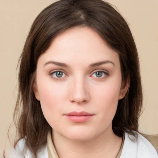 Neutral white young-adult female with medium  brown hair and grey eyes