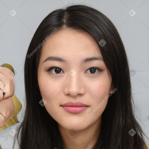 Joyful asian young-adult female with long  brown hair and brown eyes