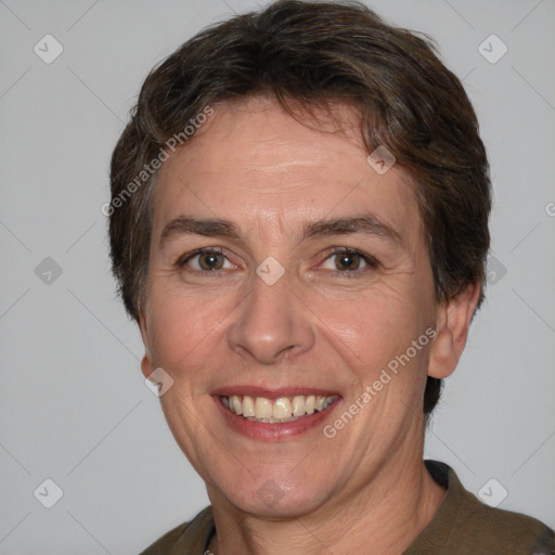 Joyful white adult female with short  brown hair and brown eyes