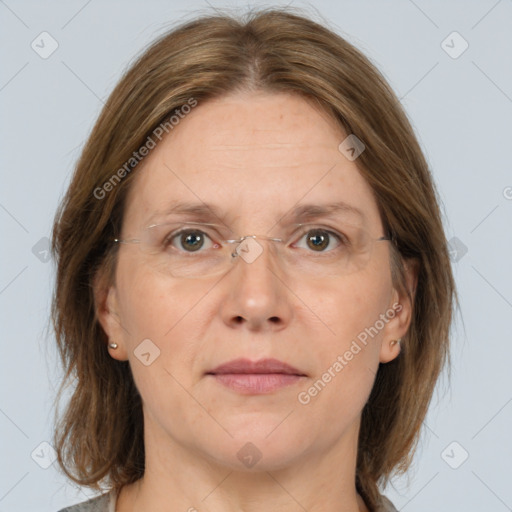 Joyful white adult female with medium  brown hair and grey eyes