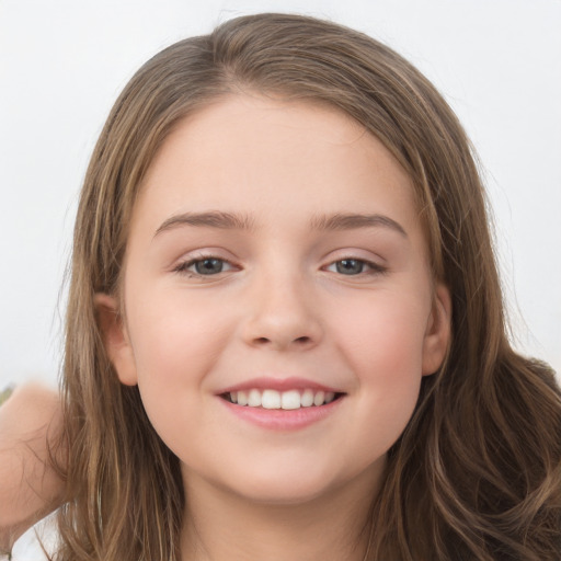 Joyful white child female with long  brown hair and brown eyes