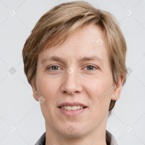 Joyful white adult male with short  brown hair and grey eyes