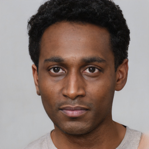 Neutral black young-adult male with short  black hair and brown eyes