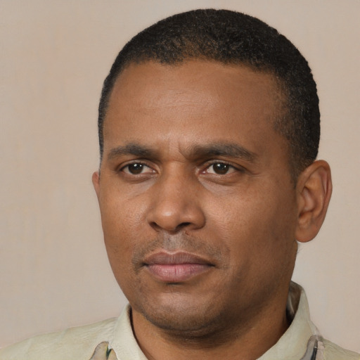 Neutral black young-adult male with short  black hair and brown eyes