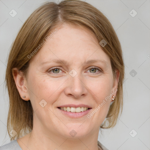 Joyful white adult female with medium  brown hair and blue eyes