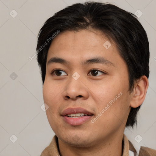 Joyful asian young-adult male with short  brown hair and brown eyes